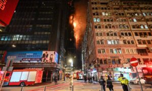 Hong Kong Firefighters Battle Blaze at High Rise Construction Site