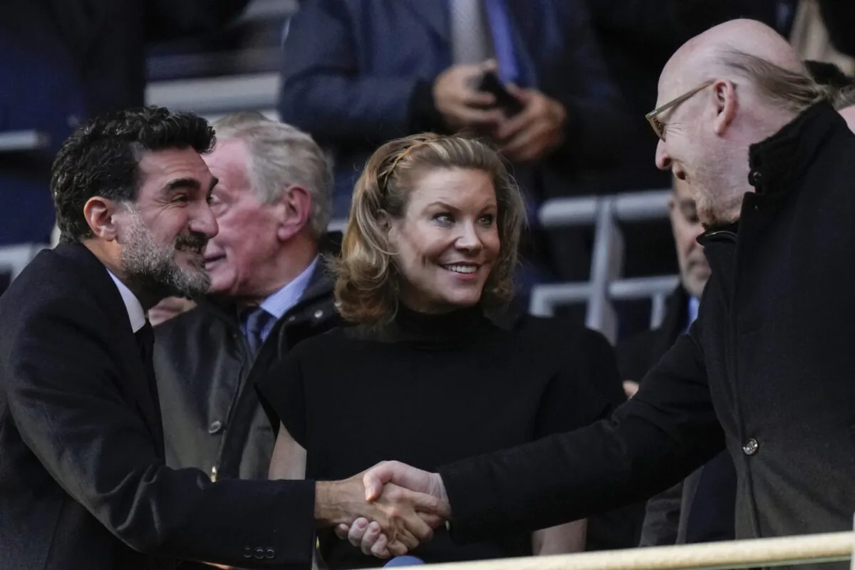 Manchester United's Chairman Avie Glazer (R) and Newcastle United's Chairman Yasir Al-Rumayyan (L) shake hands and Newcastle's Club Director Amanda Staveley (C) smiles before English League Cup final soccer match between Manchester United and Newcastle United at Wembley Stadium in London on Feb. 26, 2023. (Alastair Grant/AP Photo)