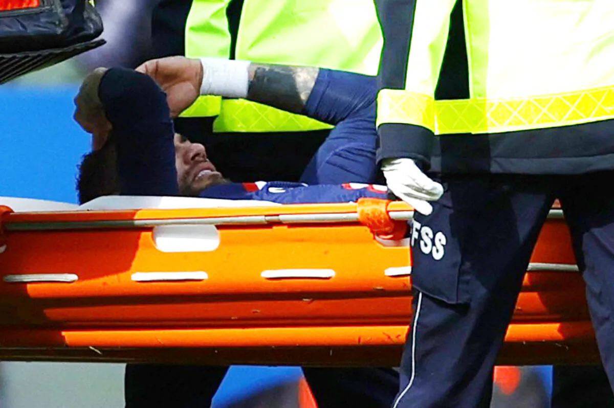 Paris St Germain's Neymar is stretchered off after sustaining an injury during the Ligue 1 - Paris St Germain v Lille Soccer match at Parc des Princes in Paris on Feb. 19, 2023. (Sarah Meyssonnier/Reuters)