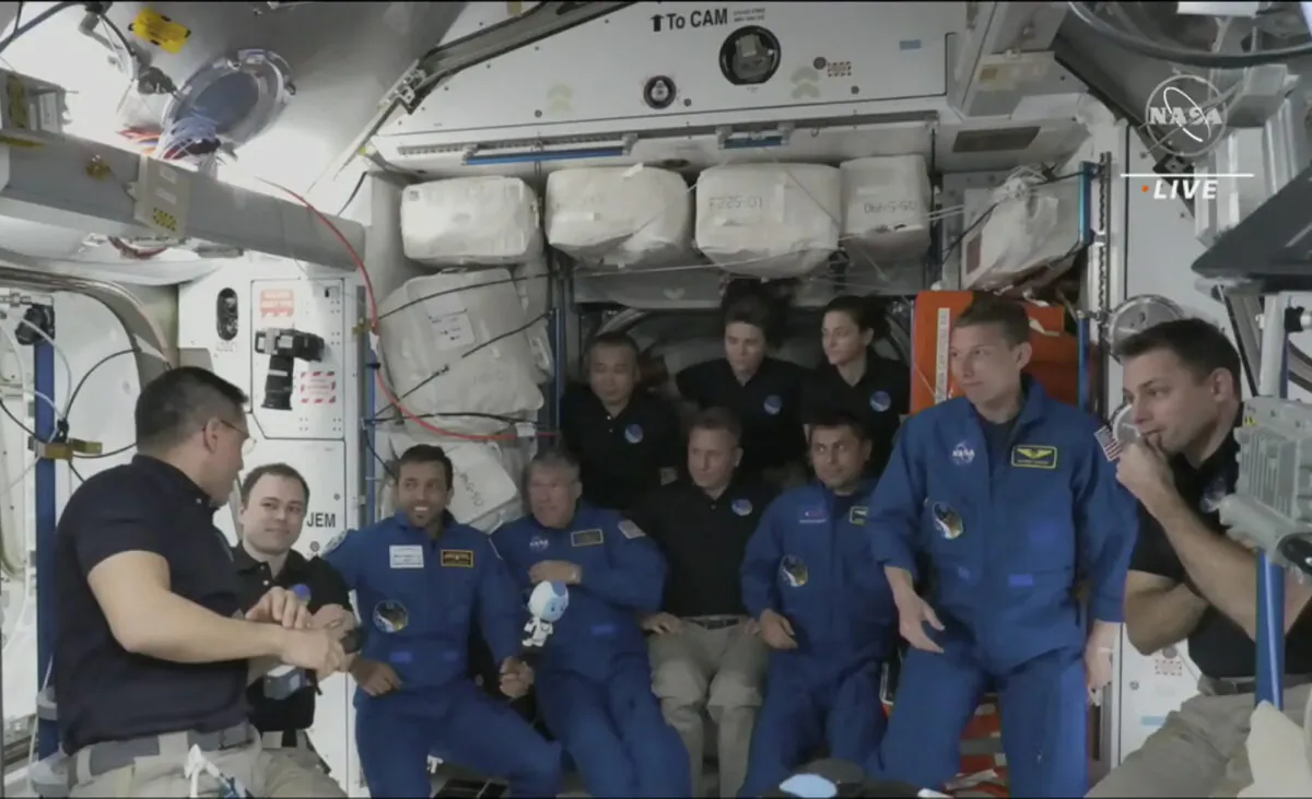The four astronauts including United Arab Emirates' Sultan al-Neyadi, (3rd-L), gather during the welcoming ceremony, on the International Space Station, on March 3, 2023. (NASA TV via AP)