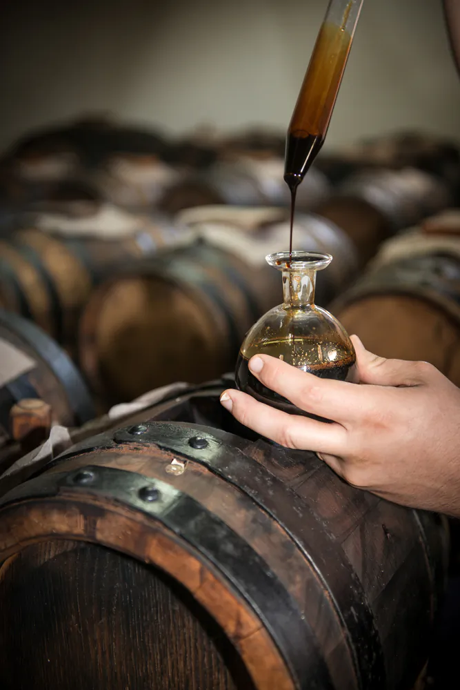 Made under strict requirements and aged for at least 12 years, pure Traditional Balsamic Vinegar of Modena has a complex flavor and thick, syrupy texture, to be doled out in precious drops. (Gua/Shutterstock)