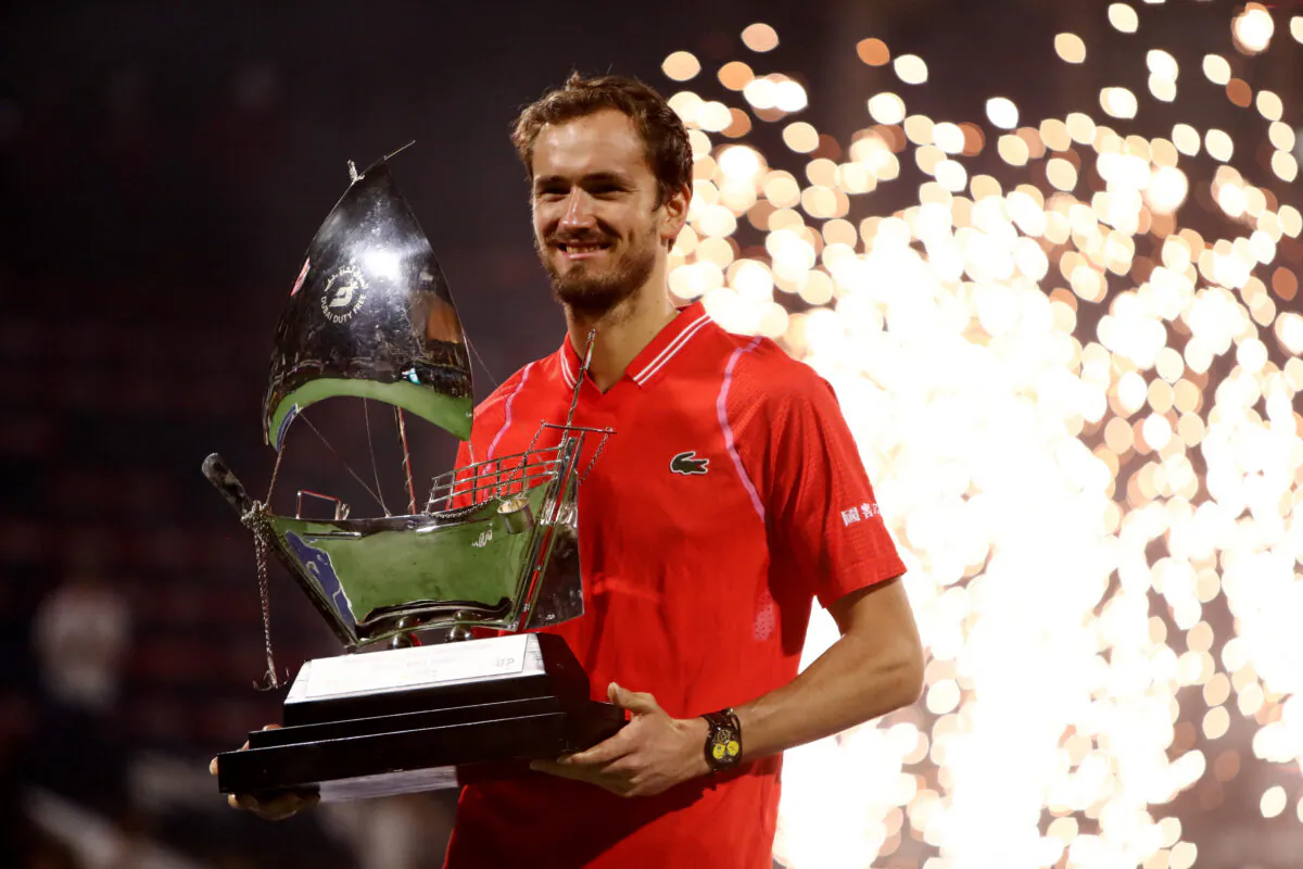 Russia's Daniil Medvedev poses with trophy after winning his final match against Russia's Andrey Rublev at the ATP Dubai Duty Free Tennis Championships in Dubai, United Arab Emirates, on March 4, 2023. (Amr Alfiky/Reuters)