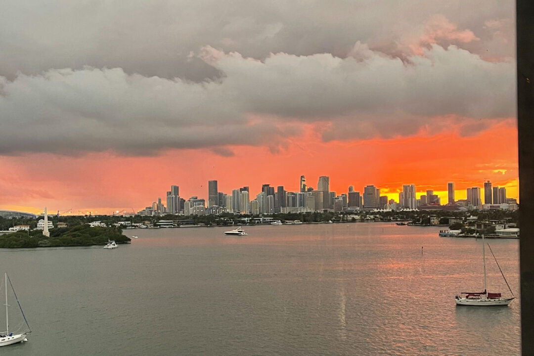 The sun sets behind northern South Beach Miami, Florida, beyond Biscayne Bay. (Photo courtesy of Candyce H. Stapen)