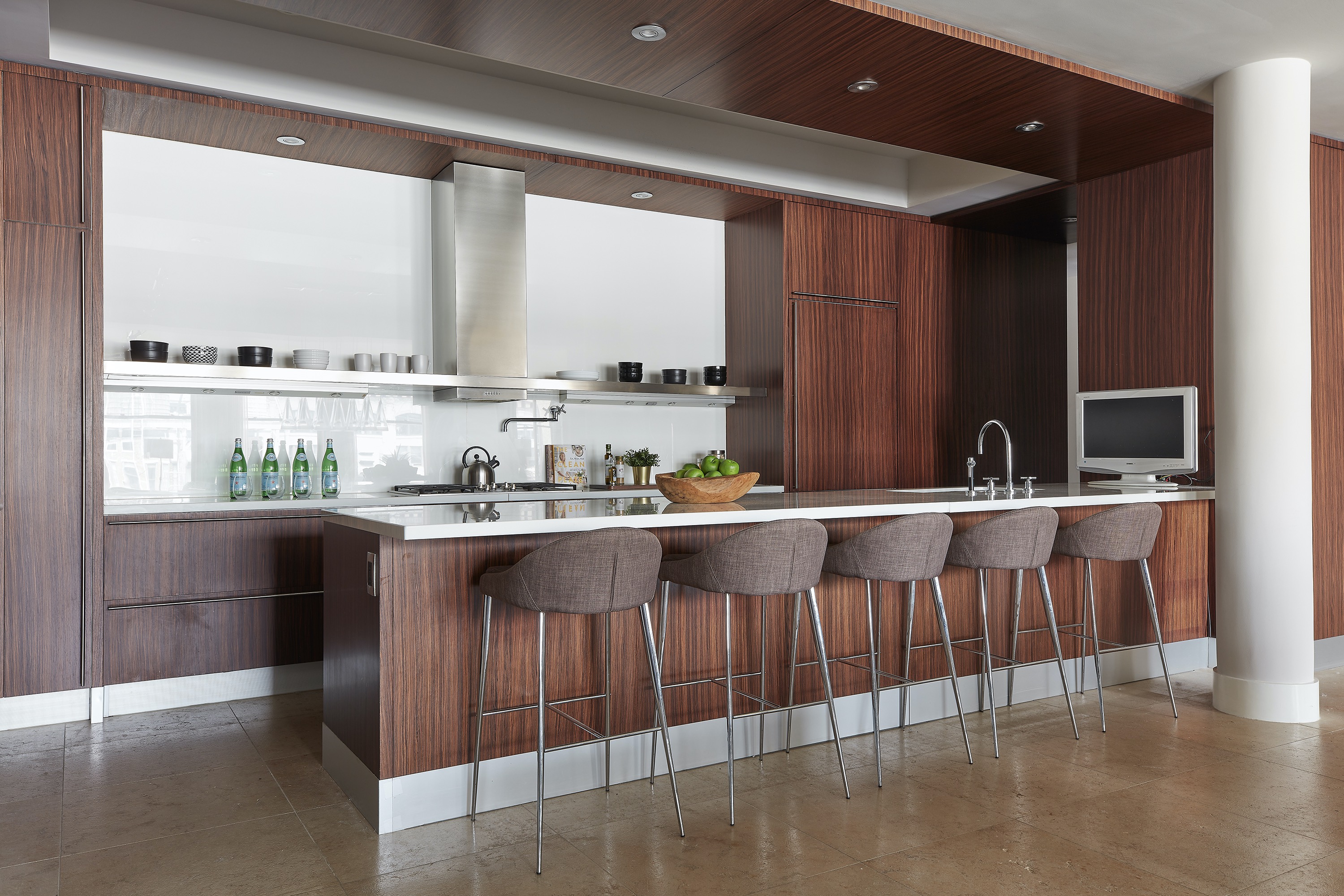 Shelves serve as an alternative to cabinetry in this modern kitchen.