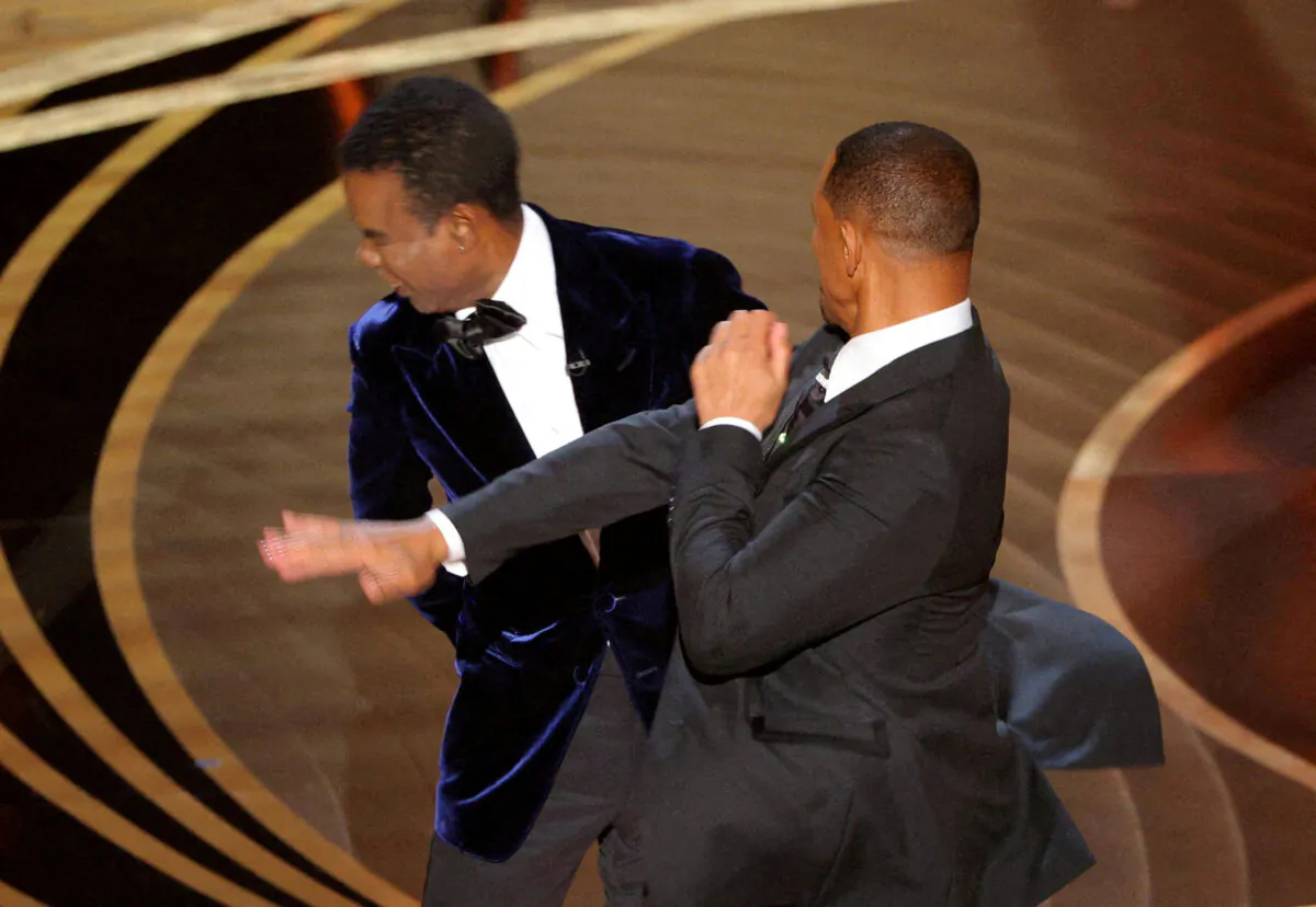 Will Smith hits Chris Rock onstage during the 94th Academy Awards in Hollywood, Calif., on March 27, 2022. (Brian Snyder/Reuters)