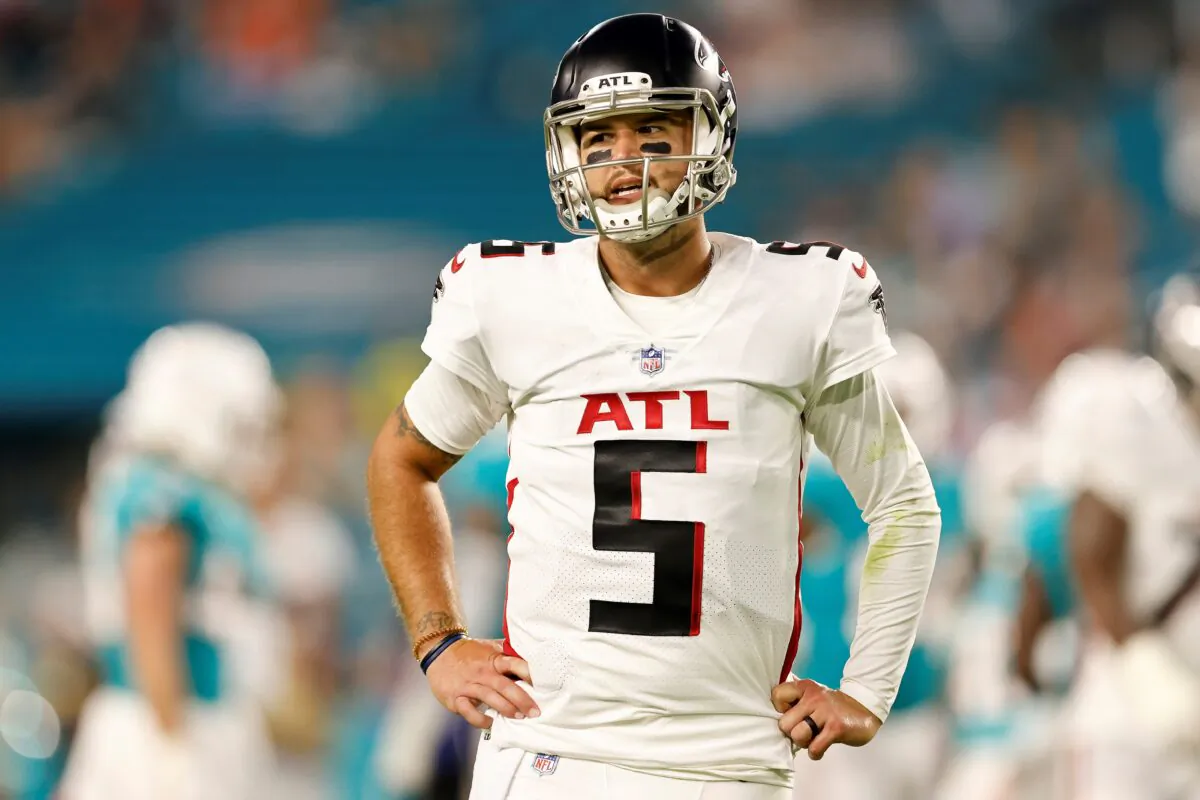 AJ McCarron (5) of the Atlanta Falcons reacts after being injured during a preseason game against the Miami Dolphins at Hard Rock Stadium in Miami Gardens, Fla., on Aug. 21, 2021. (Michael Reaves/Getty Images)
