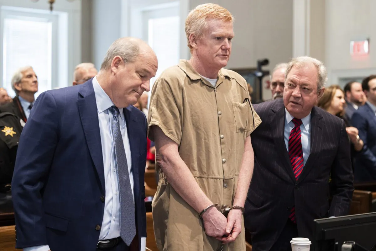 Alex Murdaugh speaks with his legal team before he is sentenced to two consecutive life sentences for the murder of his wife and son by Judge Clifton Newman at the Colleton County Courthouse in Walterboro, S.C., on March 3, 2023. (Joshua Boucher/The State via AP, Pool)