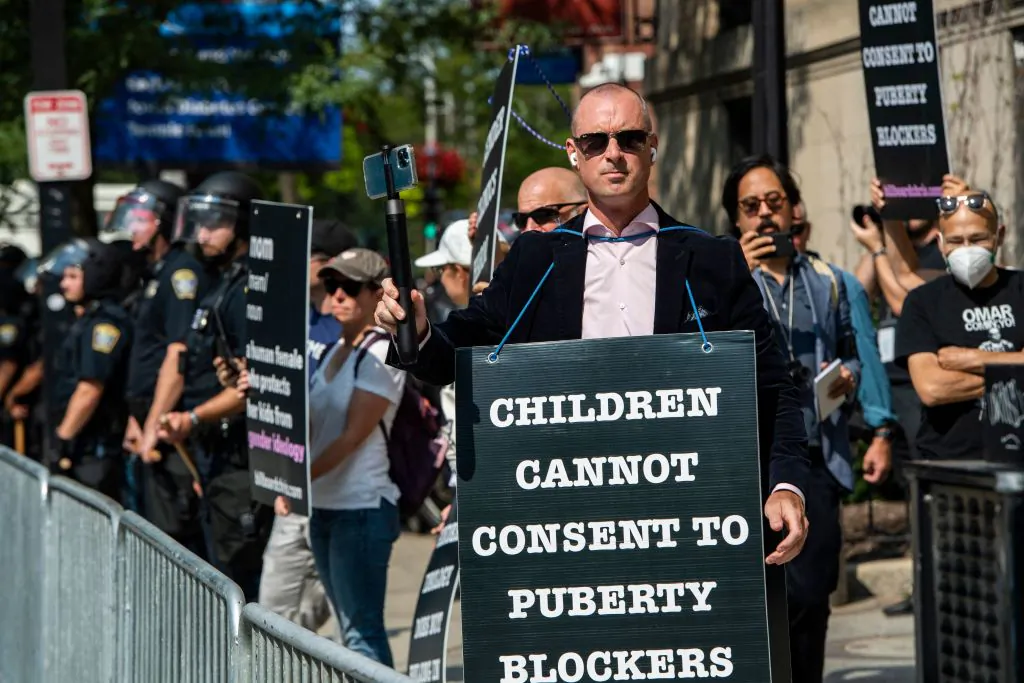 Activist Chris Elston, known as Billboard Chris, is joined by supporters in demonstrating against "gender affirmation" treatments and surgeries for minors by gathering outside Boston Children's Hospital in Boston, Mass., on Sept. 18, 2022. (Joseph Prezioso/ AFP via Getty Images)