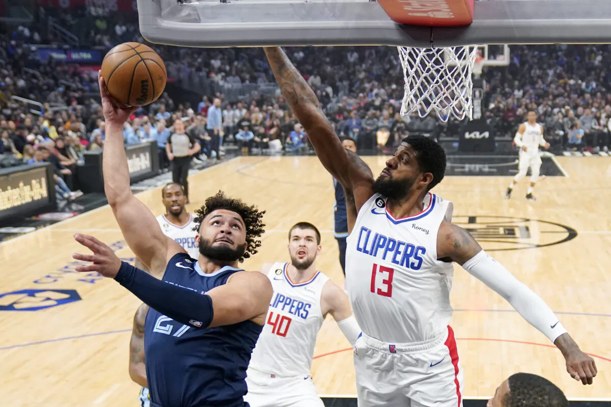 Memphis Grizzlies forward David Roddy, left, shoots as Los Angeles Clippers forward Paul George defends during the first half of an NBA basketball game in Los Angeles on March 5, 2023. (Mark J. Terrill/AP Photo)