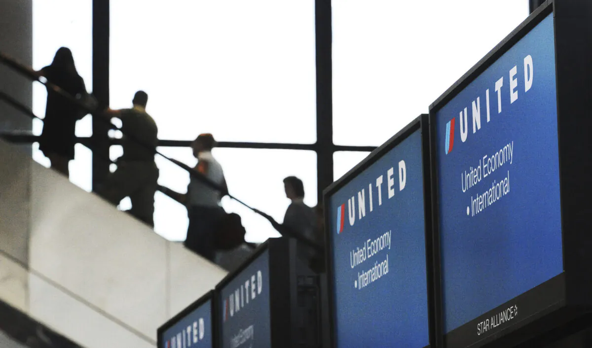 Passengers make their way through Logan International Airport in Boston on July 22, 2008. (Lisa Poole/AP Photo)