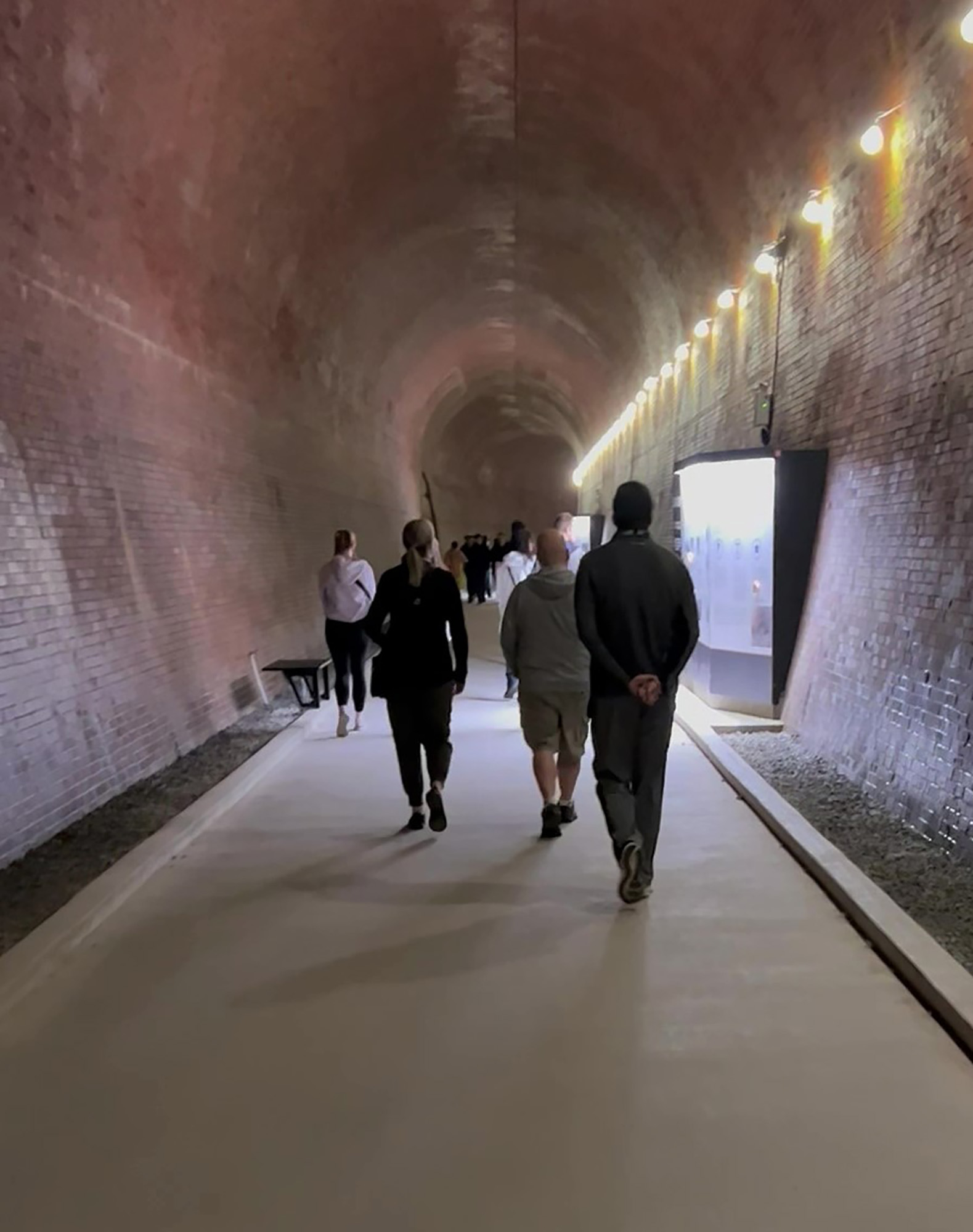Tourists walk through a 2,200-foot tunnel that opens up to a close view of the falls.