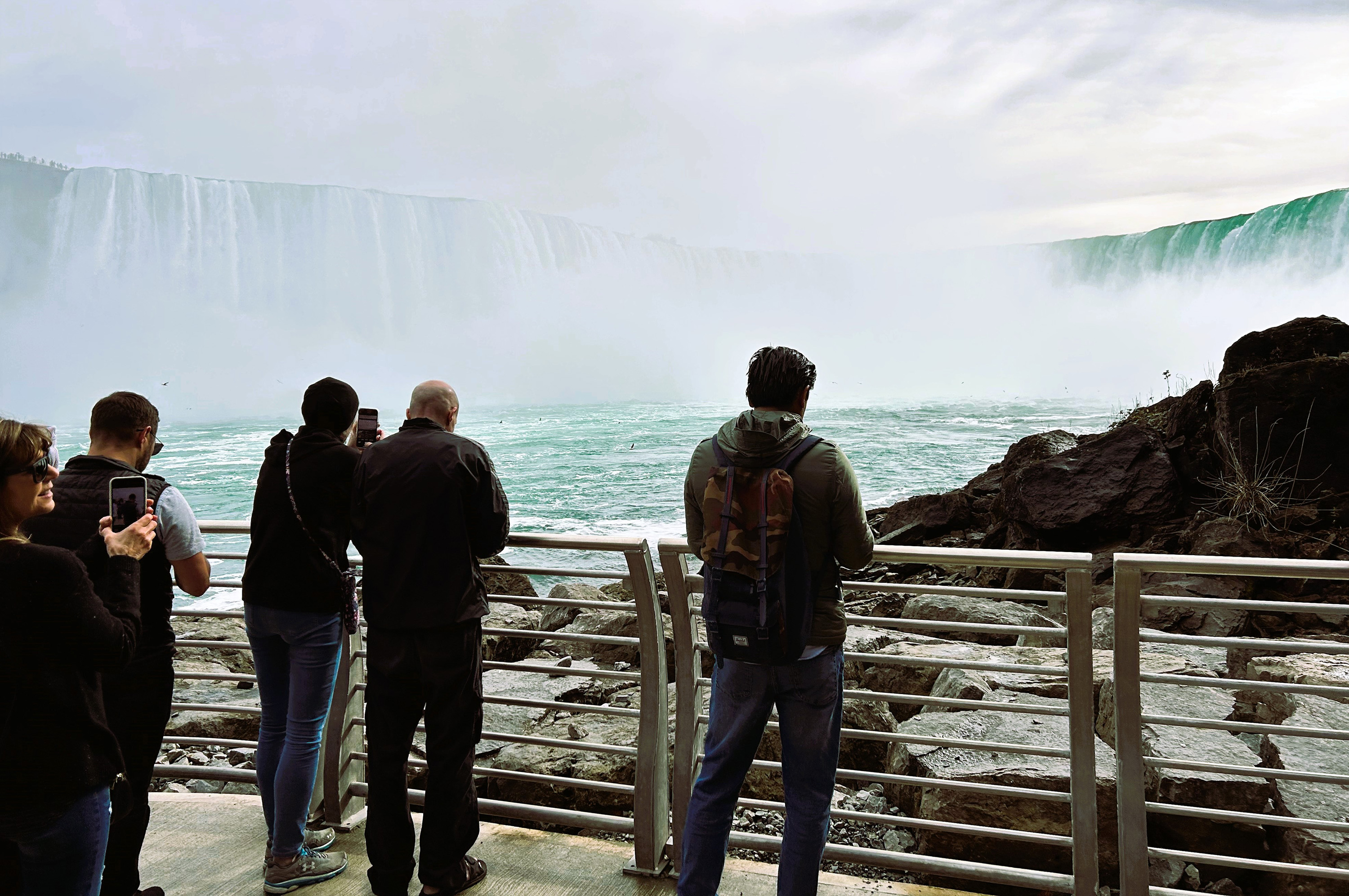 Visitors view Horseshoe Falls from the platform on the Niagara River’s edge outside of the renovated Niagara Parks Power Station. 