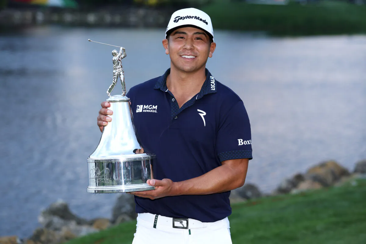 Kurt Kitayama of the United States celebrates with the trophy after winning during the final round of the Arnold Palmer Invitational presented by Mastercard at Arnold Palmer Bay Hill Golf Course in Orlando on March 5, 2023. (Richard Heathcote/Getty Images)