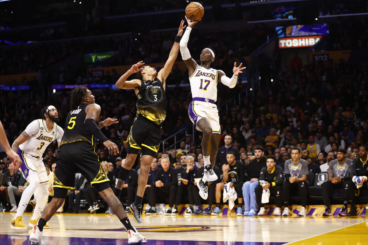 Dennis Schroder (17) of the Los Angeles Lakers takes a shot against Jordan Poole (3) of the Golden State Warriors in the second half in Los Angeles on March 5, 2023. (Ronald Martinez/Getty Images)