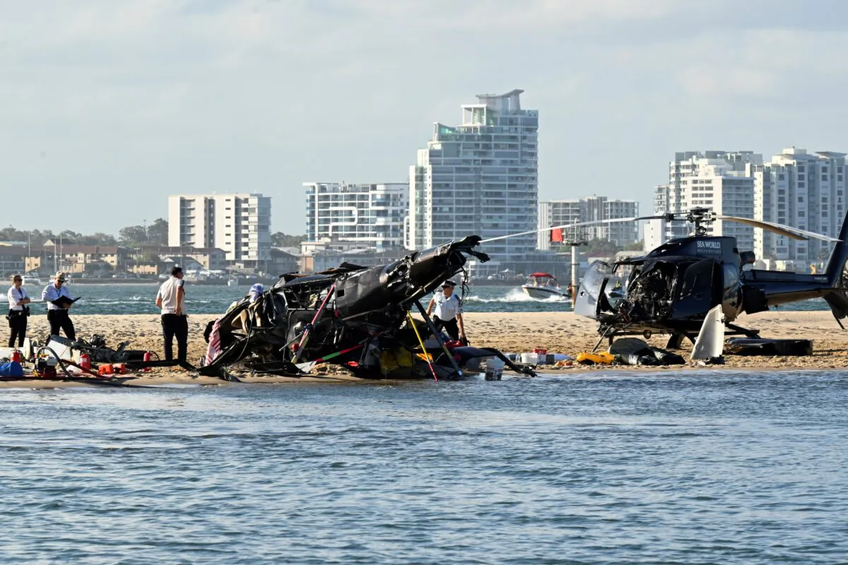Investigators work at the scene of a dual helicopter collision near Seaworld, on Australia's Gold Coast, on Jan. 2, 2023. (Dave Hunt/AAP Image via AP)