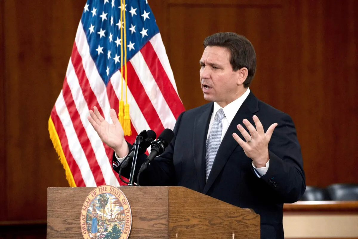 Florida Gov. Ron DeSantis answers questions from the media in the Florida Cabinet following his State of the State address on March 7, 2023. (Cheney Orr/AFP via Getty Images)