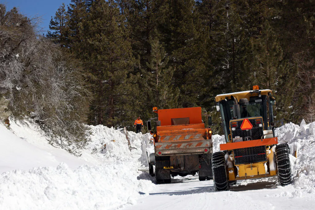 Caltrans workers inspect the damage caused by an avalanche on California State Route 38 after a series of snow storms near Big Bear, Calif., on March 2, 2023. (Michael Heiman/Getty Images)