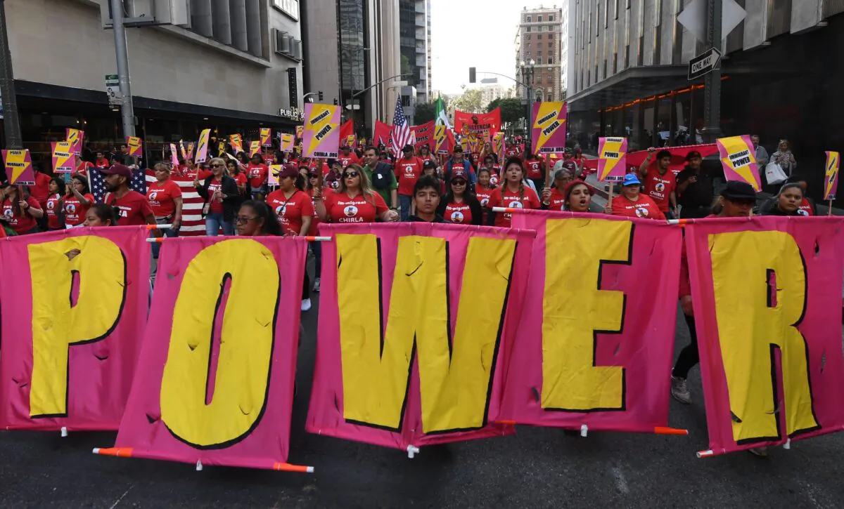 Union members, activists, and their supporters march during their annual May Day procession in Los Angeles on May 1, 2019. (Mark Ralston/AFP via Getty Images)