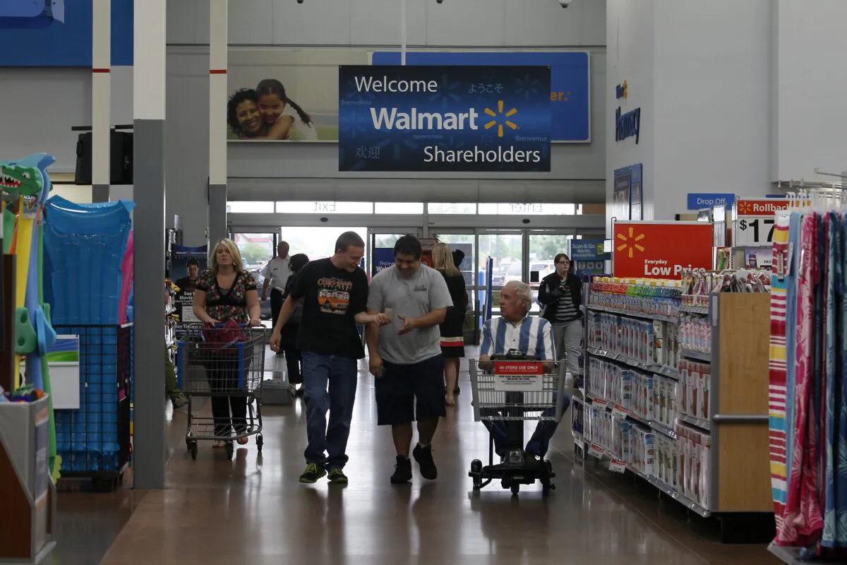 Customers shop at a Walmart Supercenter in Rogers, Ark., on June 6, 2013. (Rick Wilking/Reuters)