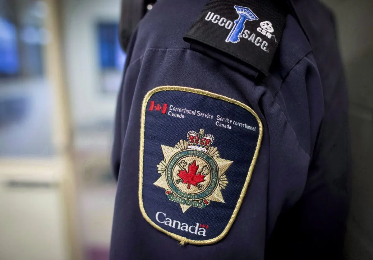 Patches are seen on the arm and shoulder of a corrections officer in the segregation unit at the Fraser Valley Institution for Women during a media tour, in Abbotsford, B.C., on Oct. 26, 2017. (The Canadian Press/Darryl Dyck)