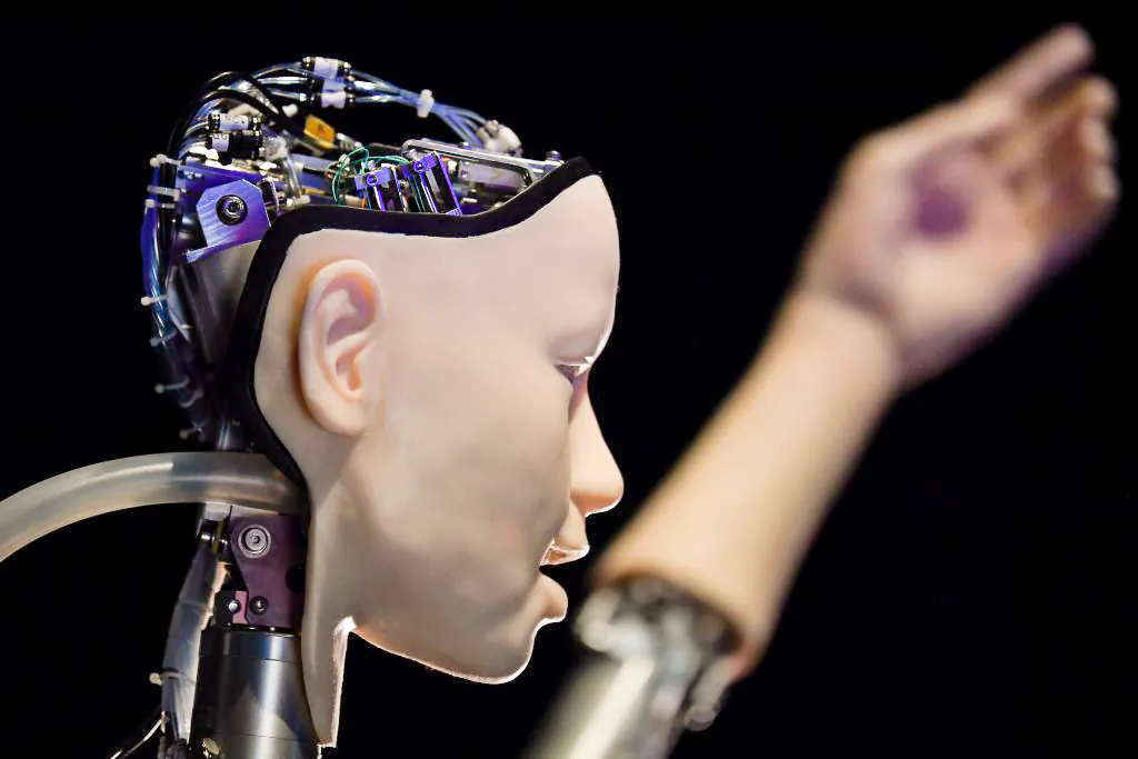 An AI robot titled "Alter 3: Offloaded Agency," is pictured during a photocall to promote the exhibition entitled "AI: More than Human," at the Barbican Centre in London on May 15, 2019. (Ben Stansall/AFP via Getty Images)