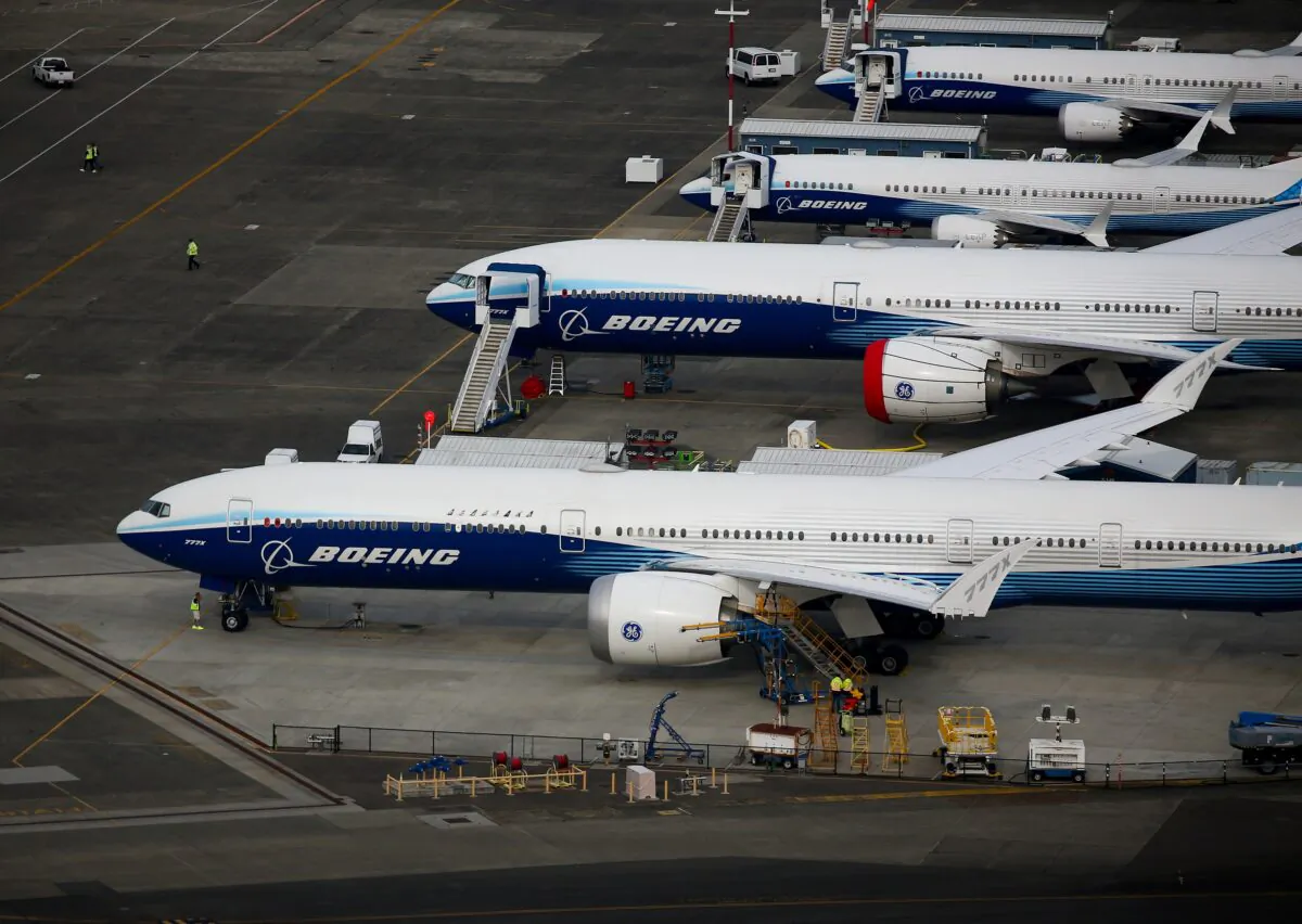Boeing 777X and Boeing 737 MAX 10 airplanes are seen parked in an aerial view at King County International Airport-Boeing Field in Seattle on June 1, 2022. (Lindsey Wasson/Reuters)