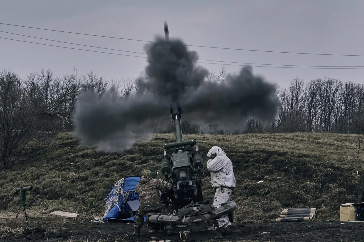 Ukrainian soldiers fire a self-propelled howitzer towards Russian positions near Bakhmut, the site of the heaviest battles, Donetsk region, Ukraine, on March 7, 2023. (Libkos/AP Photo)