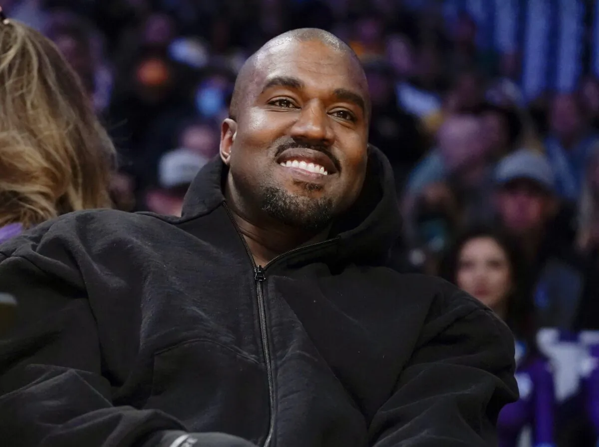 Kanye West, known as Ye, watches the first half of an NBA basketball game between the Washington Wizards and the Los Angeles Lakers in Los Angeles on March 11, 2022. (Ashley Landis/AP Photo)