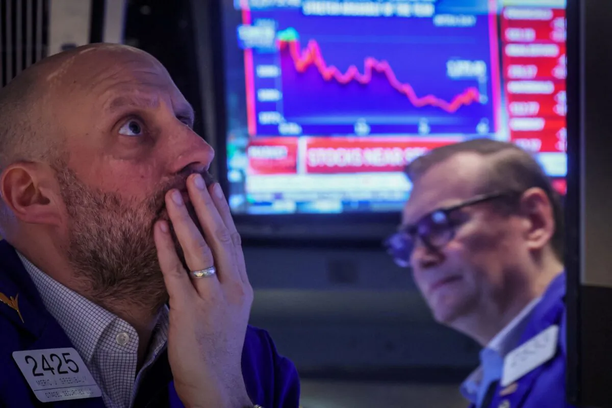 Traders work on the floor of the New York Stock Exchange (NYSE) in New York on March 7, 2023. (Brendan McDermid/Reuters)