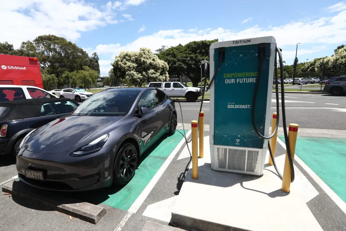 A Tesla vehicle is charged at a charging station in Gold Coast, Australia, on Feb. 16, 2023. (AAP Image/Jason O'Brien)