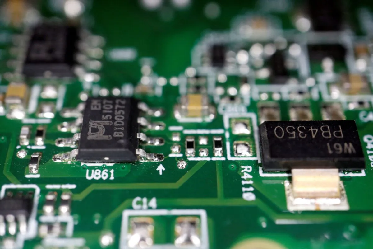 Semiconductor chips on a printed circuit board in an illustration picture taken on Feb. 17, 2023. (Florence Lo/Illustration/Reuters)