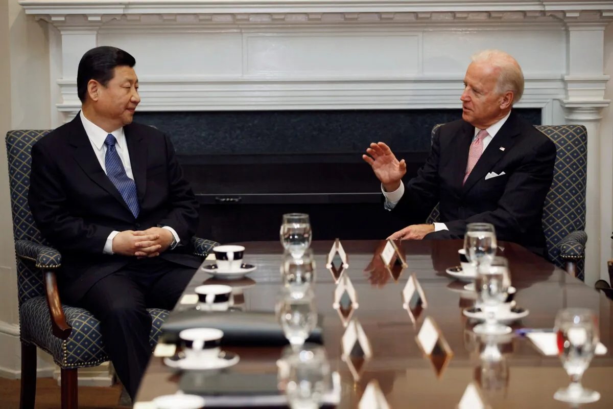 U.S. Vice President Joe Biden (R) and Chinese leader Xi Jinping talk during an expanded bilateral meeting with other United States and Chinese officials in the Roosevelt Room at the White House in Washington on Feb. 14, 2012. (Chip Somodevilla/Getty Images)