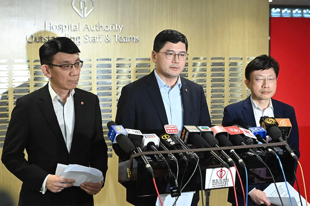 Tony Ko Pat Sing (center) apologized after multiple industrial incidents in public hospitals. Ko stated on March. 9, 2023 that a committee had been set up to review the incidents. (Sung Pi-long/The Epoch Times)