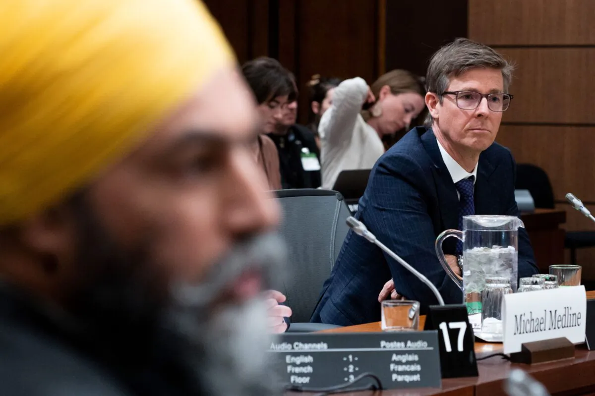 Galen Weston, chairman and president of Loblaw Companies (R) and NDP Leader Jagmeet Singh attend the Standing Committee on Agriculture and Agri-Food (AGRI) investigating food price inflation in Ottawa on March 8, 2023. (Spencer Colby/The Canadian Press)