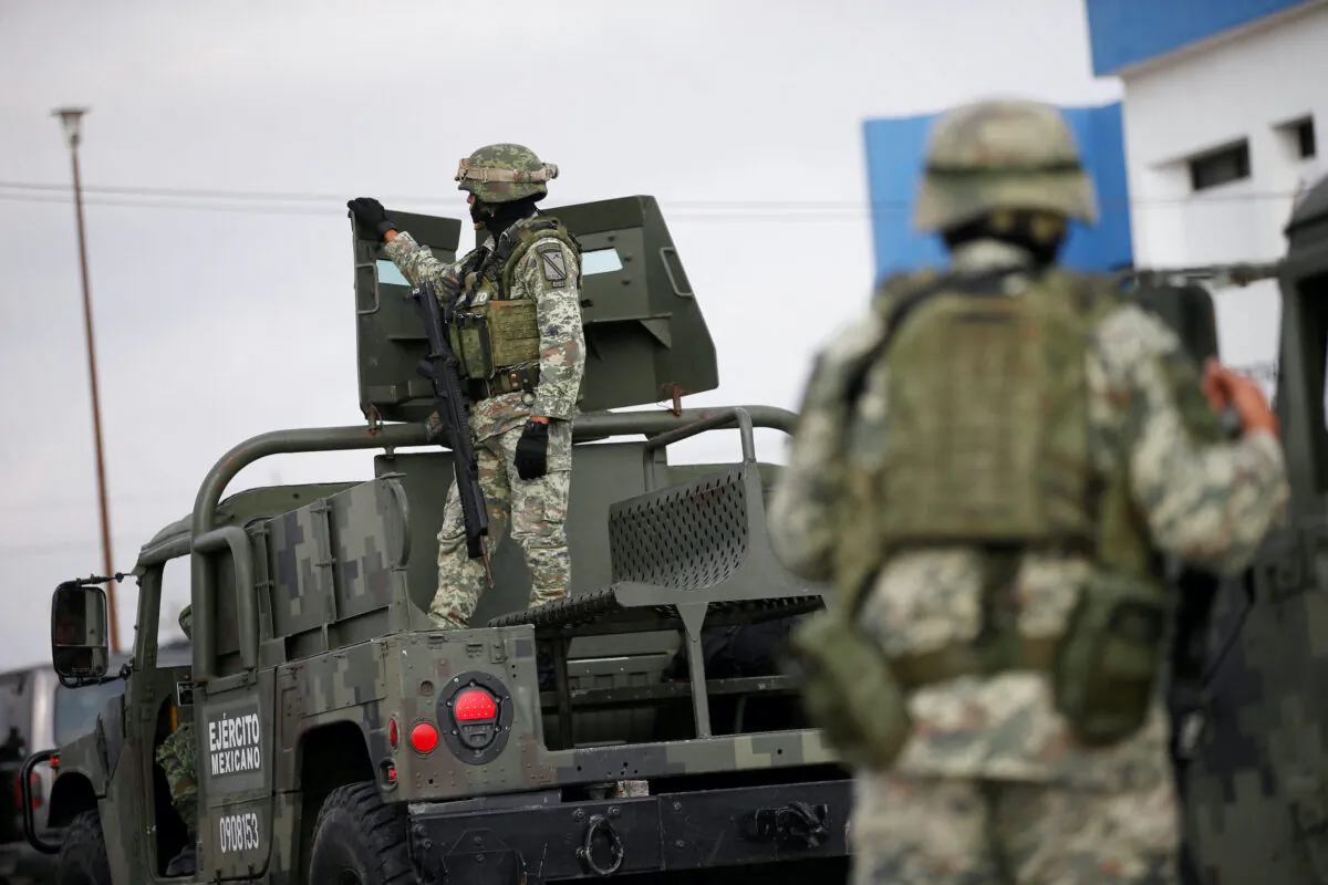 Soldiers stand guard outside the Forensic Medical Service morgue building ahead of the transfer of the bodies of two of four Americans kidnapped by gunmen to the U.S. border, in Matamoros, Mexico, on March 9, 2023. (Daniel Becerril/Reuters)