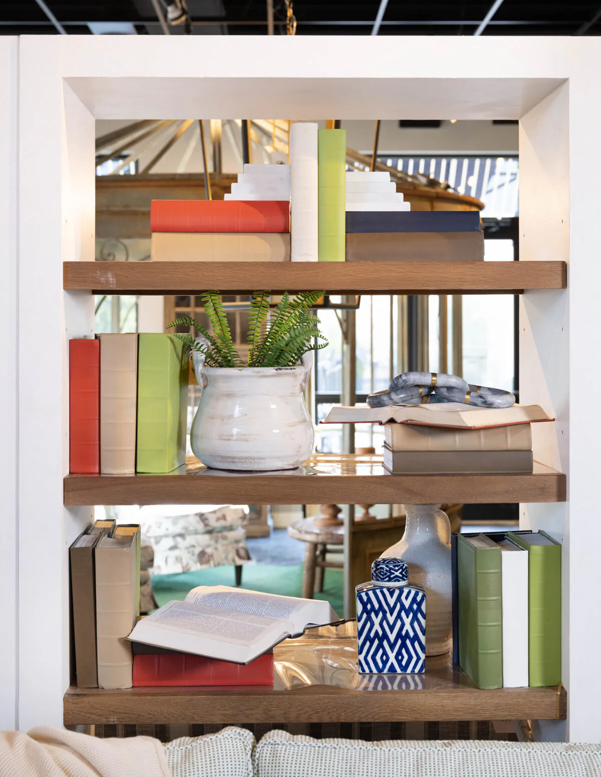 If you're having trouble getting started, try placing your first few large or statement pieces in a rough triangle on your shelves — one piece toward the top center, another roughly on the middle left, and another on the lower right. (Handout/TNS)
