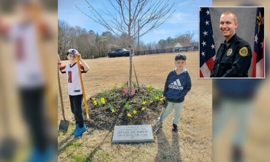 Boys Spend Weekend Planting Flowers at Memorial of Young Officer Killed in the Line of Duty