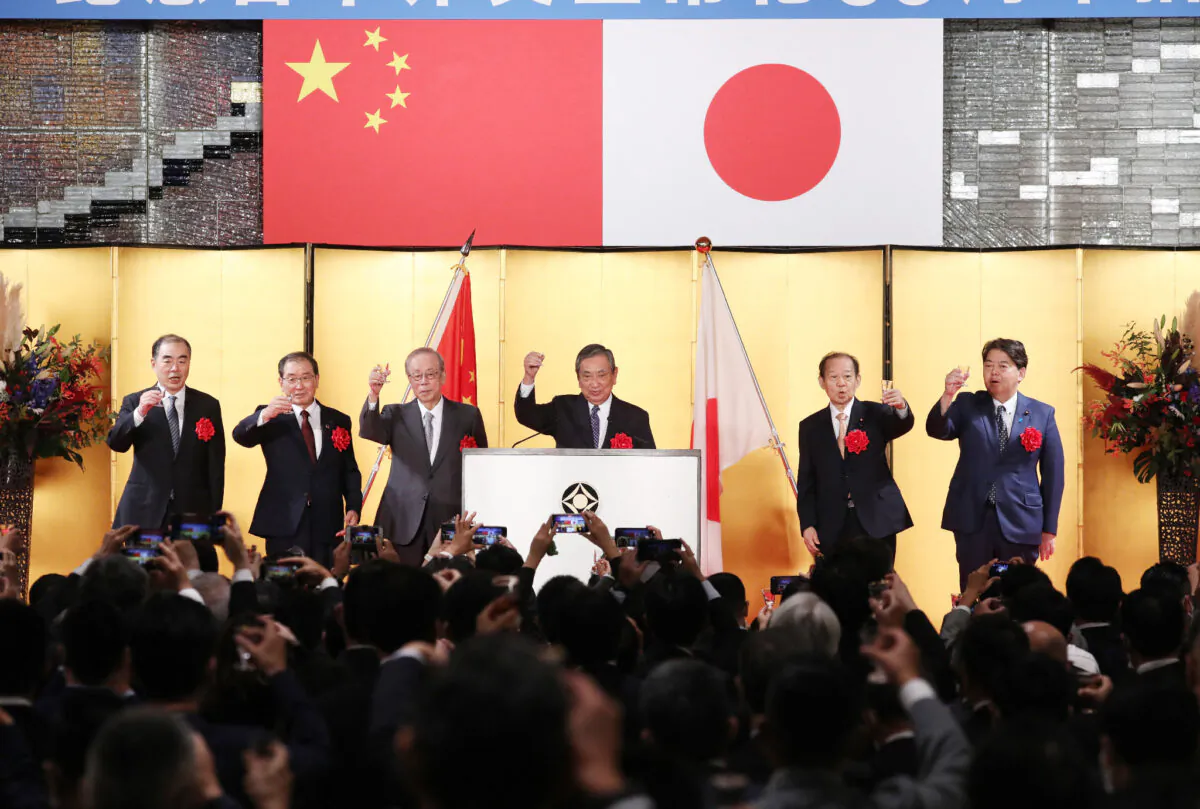 (From L-R) Chinese Ambassador to Japan Kong Xuanyou, Keidanren Chairman Masakazu Tokura, former prime minister Yasuo Fukuda, former speaker of the lower house Yohei Kono, former secretary-general of the Liberal Democratic Party Toshihiro Nikai, and Foreign Minister Yoshimasa Hayashi make a toast at the reception commemorating the 50th anniversary of the normalization of Japan-China diplomatic relations in Tokyo on Sept. 29, 2022. (Jiji Press / AFP / Japan OUT via Getty Images)
