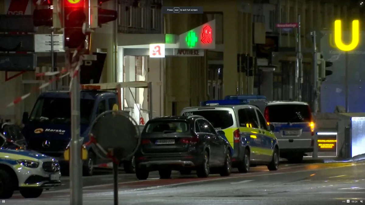 German police vehicles at the scene of a hostage situation inside a pharmacy in Karlsruhe, Germany, on March 10, 2023. (Reuters TV via Reuters)