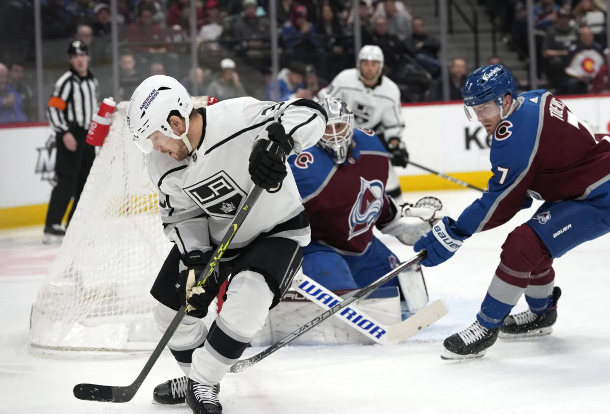 Los Angeles Kings right wing Viktor Arvidsson, front, collects the puck as Colorado Avalanche goaltender Alexandar Georgiev, back left, and defenseman Devon Toews protect the net in the second period of an NHL hockey game in Denver on March 9, 2023. (David Zalubowski/AP Photo)