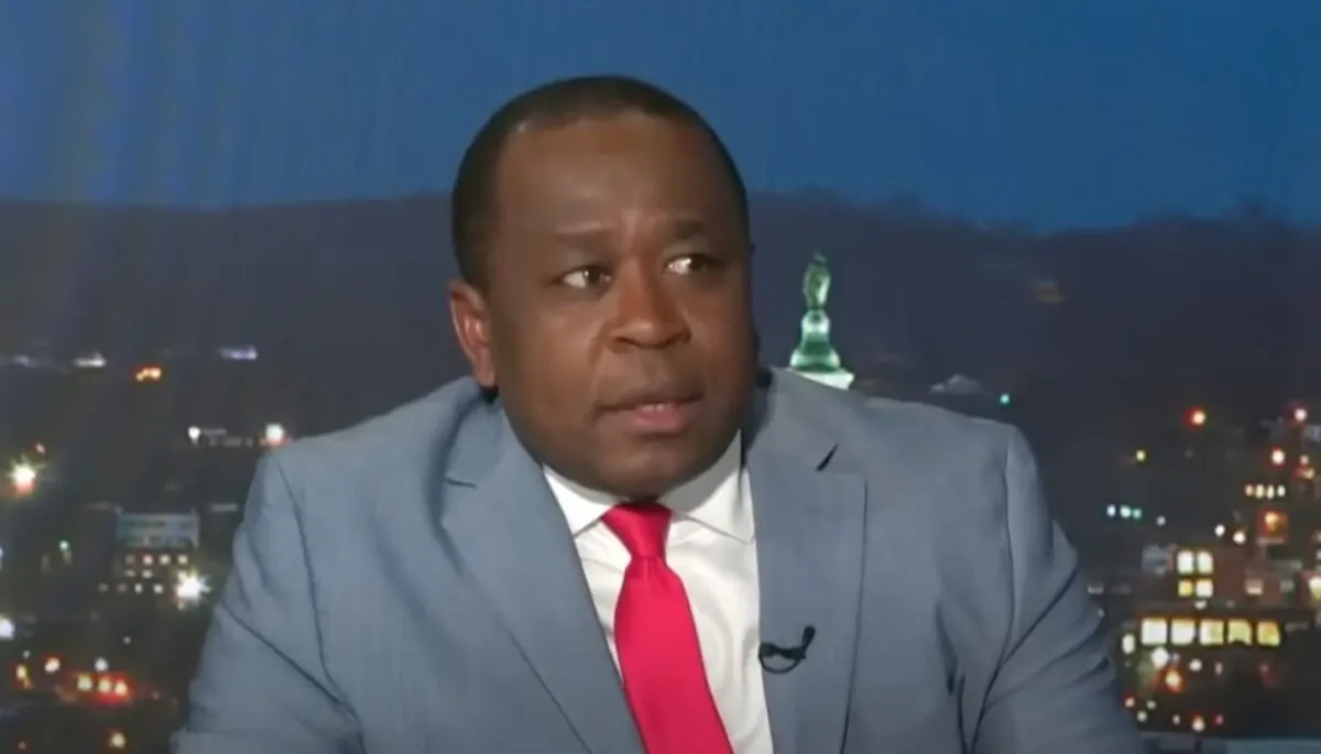 Journalist Simon Ateba during a television interview. (Screenshot via Newsmax/YouTube)