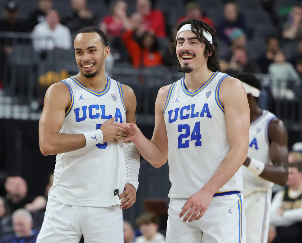 Amari Bailey (5) and Jaime Jaquez Jr. (24) of the UCLA Bruins celebrate on the court late in the in the second half of a quarterfinal game of the Pac-12 basketball tournament Colorado Buffaloes at T-Mobile Arena in Las Vegas on March 9, 2023. (Ethan Miller/Getty Images)