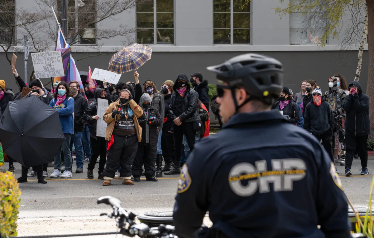 Antifa activists gather at the California State Capitol building in protest of DeTrans Awareness Day in Sacramento, Calif., on March 10, 2023. (John Fredricks/The Epoch Times)