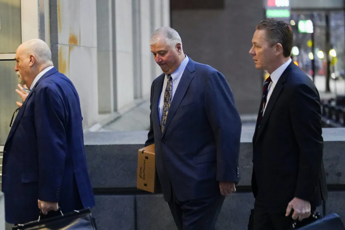 Former Ohio House Speaker Larry Householder (C), walks into Potter Stewart U.S. Courthouse with his attorneys, Mark Marein (L), and Steven Bradley (R), before jury selection in his federal trial in Cincinnati, Ohio, on Jan. 20, 2023. (Joshua A. Bickel/AP Photo)