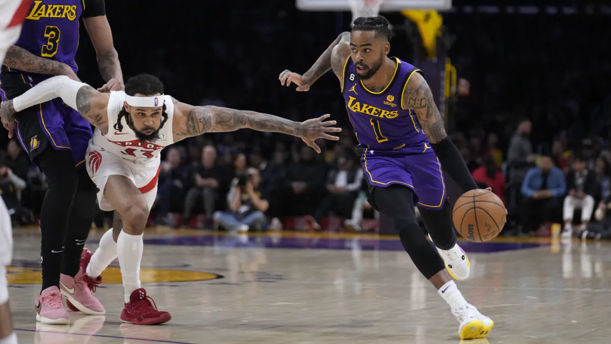 Los Angeles Lakers guard D'Angelo Russell (1) dribbles past Toronto Raptors guard Gary Trent Jr. during the first half of an NBA basketball game in Los Angeles on March 10, 2023. (Marcio Jose Sanchez/AP Photo)