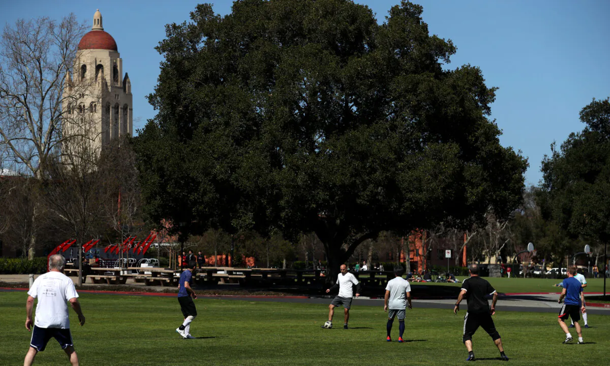 People play soccer near Hoover Tower on the Stanford University campus in Stanford, Calif., on March 12, 2019. (Justin Sullivan/Getty Images)