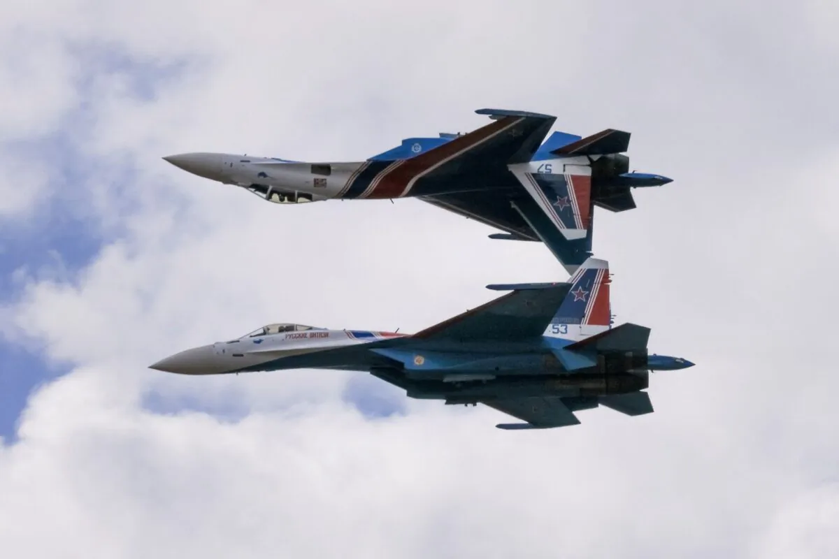 Sukhoi Su-35S jet fighters of the Russkiye Vityazi (Russian Knights) aerobatic team perform during the MAKS 2021 air show in Zhukovsky, outside Moscow, Russia, on July 25, 2021. (Tatyana Makeyeva/Reuters)