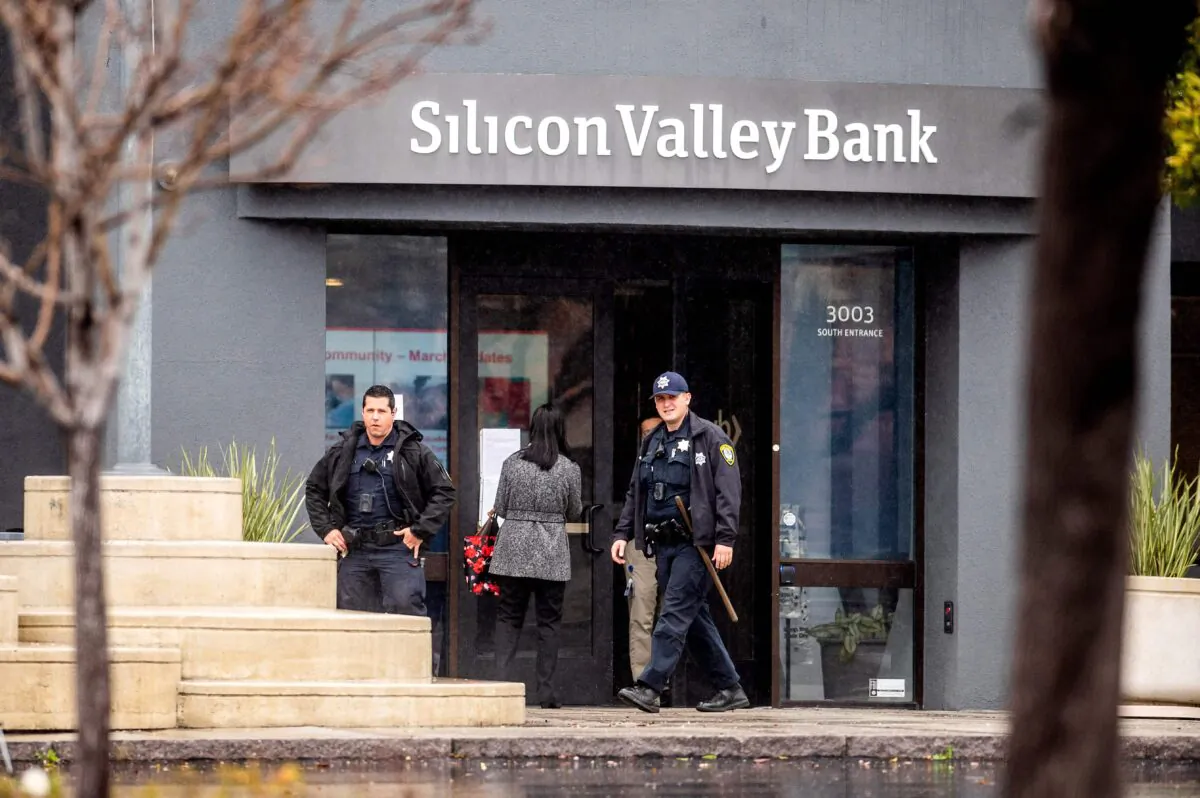 Police officers leave Silicon Valley Bank's headquarters in Santa Clara, California, on March 10, 2023. (Noah Berger/AFP via Getty Images)