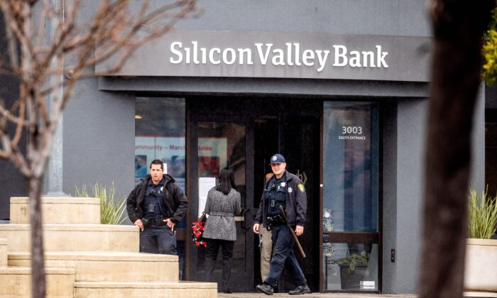 Police officers leave Silicon Valley Bank's headquarters in Santa Clara, California, on March 10, 2023. (Noah Berger/AFP via Getty Images)