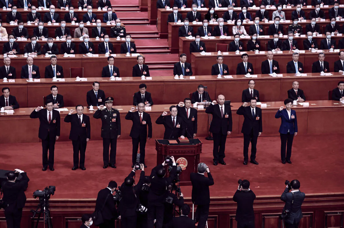 (L-3)Li Shangfu, China's swears an oath at the Great Hall of the People in Beijing on March 12, 2023. (Noel Celis / AFP via Getty Images)